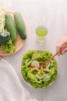 vegetable green salad bowl on kitchen table, balanced diet