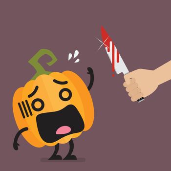 Hand with a knife prepare to cut the funny pumpkin character