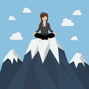 Business woman meditating on a mountain peak