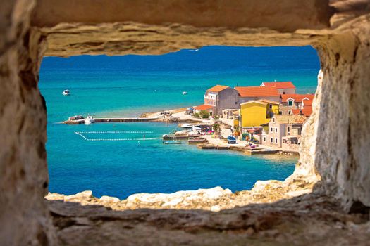 Island of Krapanj colorful waterfront view through stone window