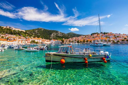 View at amazing archipelago with boats in front of town Hvar, Croatia. Harbor of old Adriatic island town Hvar. Popular touristic destination of Croatia. Amazing Hvar city on Hvar island, Croatia. 