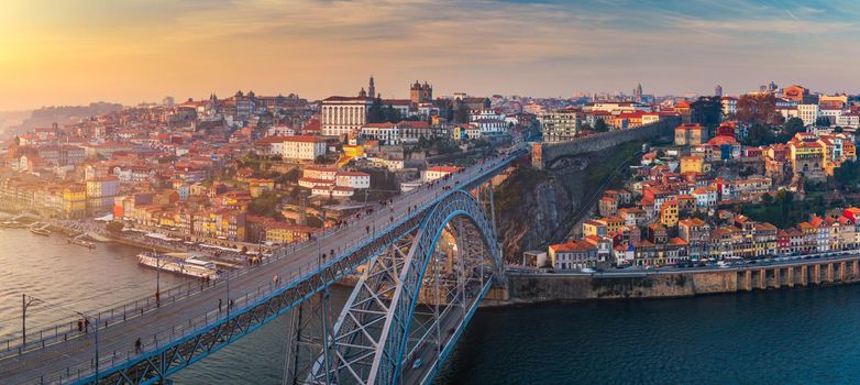Porto panoramic aerial view of Dom Luis Bridge at sunset. Porto, Portugal. Cityscape of Porto downtown touristic Ribeira