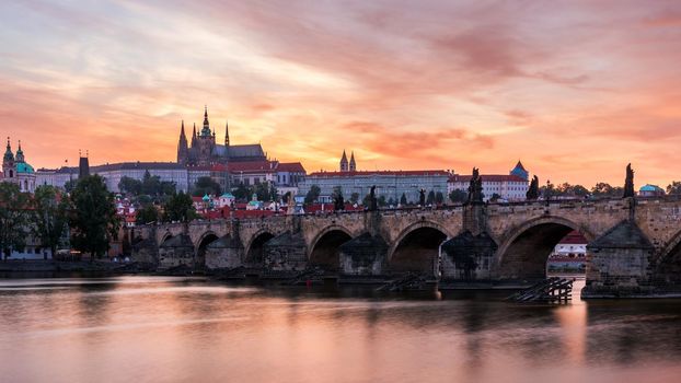 Charles Bridge at sunset with colorful sky, Prague, Czech Republic. Prague old town and iconic Charles bridge and Castle, Czech Republic. Charles Bridge (Karluv Most), Old Town Tower and Castle.