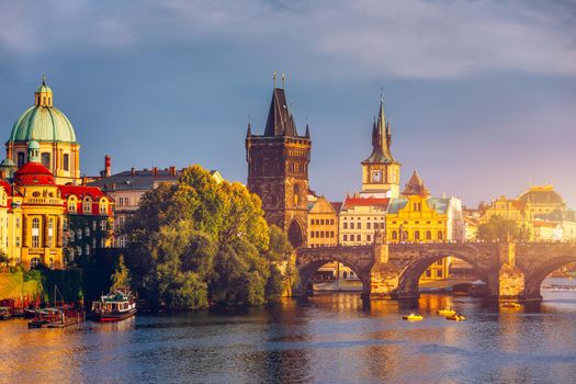 Charles Bridge in Prague in Czechia. Prague, Czech Republic. Charles Bridge (Karluv Most) and Old Town Tower. Vltava River and Charles Bridge. Concept of world travel, sightseeing and tourism.