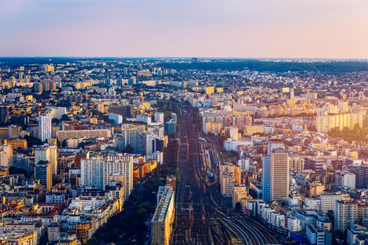 Top view of Paris skyline from above. Main landmarks of european megapolis with train station of Vaugirard-Belt. Bird-eye view from observation deck of Montparnasse tower. Paris, France