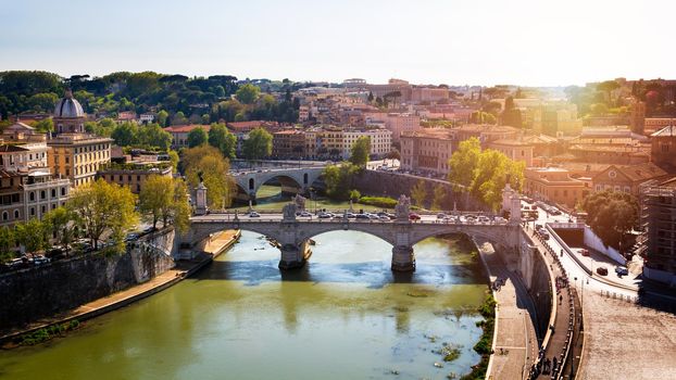 Skyline with bridge Ponte Vittorio Emanuele II and classic architecture in Rome, Vatican City scenery over Tiber river.