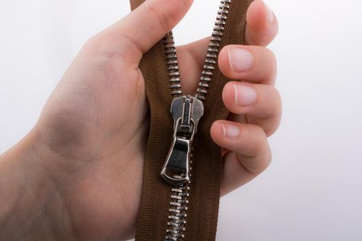 Hand holding zipper