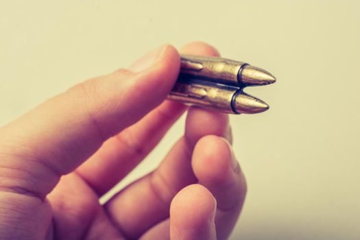 Bullet in  hand as Conceptual  against the war photography 