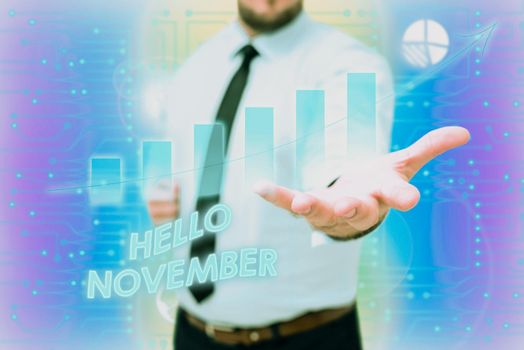 Text showing inspiration Hello November. Business showcase greeting used when welcoming the eleventh month of the year Gentelman Uniform Standing Holding New Futuristic Technologies.