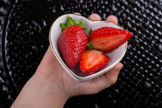 A juicy, sweet and ripe strawberry fruit in bowl