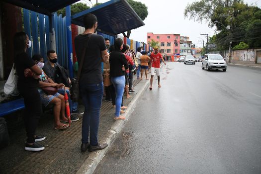 salvador, bahia, brasil - 22 de junho de 2021: Passengers are seen waiting for public transport at a bus stop in the Cabula neighborhood of the city of Salvador, due to a drivers strike.