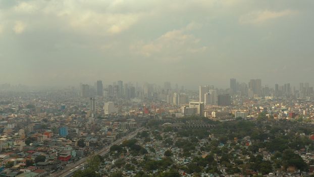 Manila city with skyscrapers, Philippines aerial view.