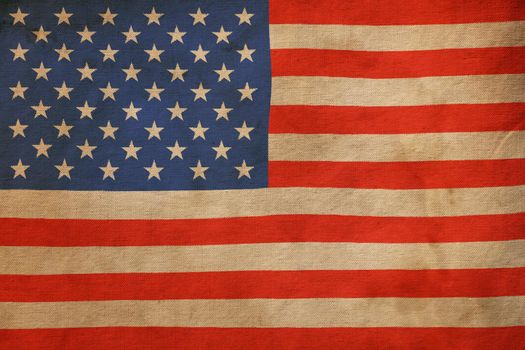 Old vintage faded American US flag on canvas