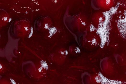 Fresh ripe lingonberry sauce close-up. Food background, texture, top view.
