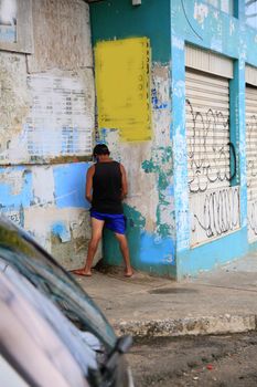 
person urinating in the street in salvador
