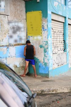 
person urinating in the street in salvador
