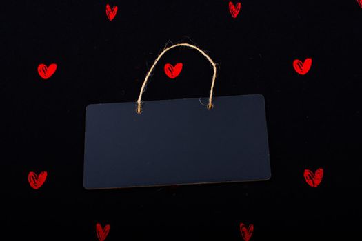 Rectangular shaped black notice board  and red hearts