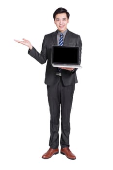 Young handsome businessman standing and holding laptop .Isolated on white background.