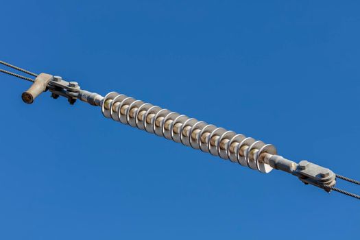 Photograph of a tensioner bracket on a transmission line