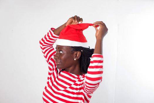 portrait of young woman with Santa Claus hat.